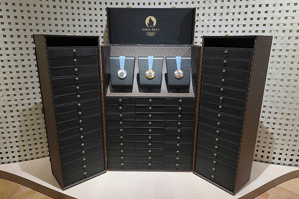 Monogrammed trunk to protect and display the medals - | Photo: AP/Rebecca Blackwell